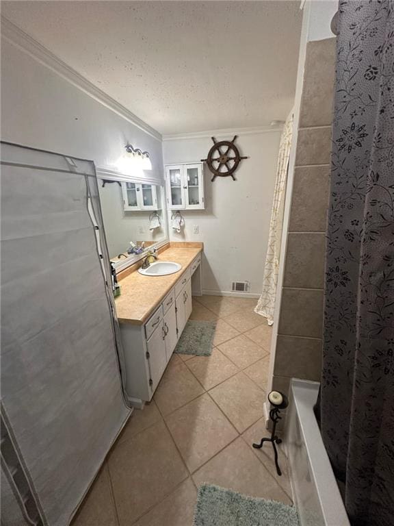 bathroom with tile patterned floors, ornamental molding, shower / tub combo, and vanity