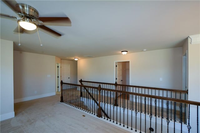 carpeted empty room with ceiling fan