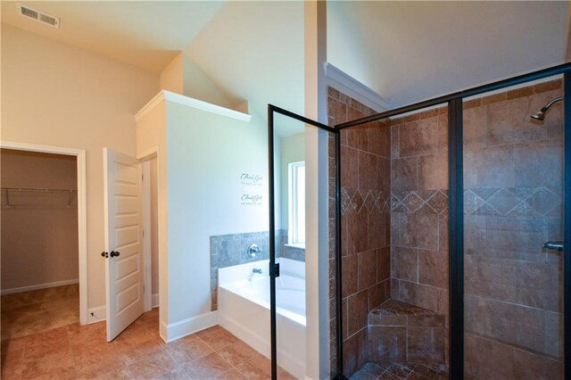 bathroom featuring tile patterned floors and shower with separate bathtub