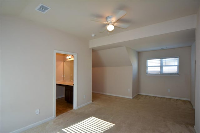 bonus room with light carpet, ceiling fan, and lofted ceiling