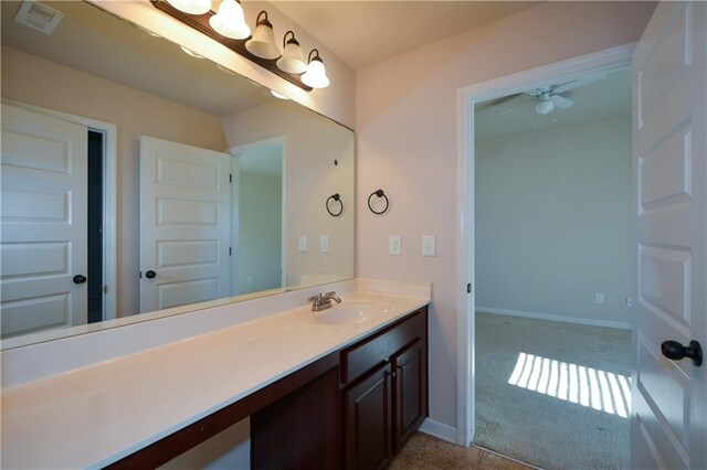 bathroom featuring ceiling fan and vanity