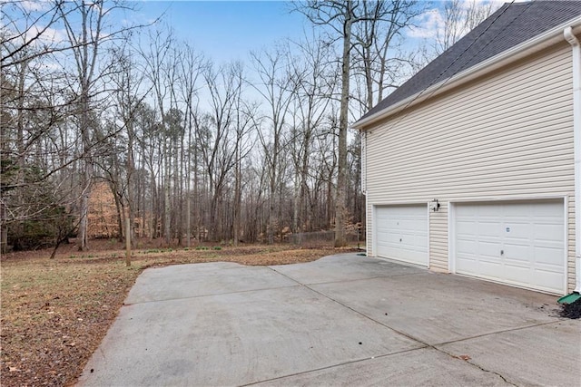 exterior space featuring concrete driveway