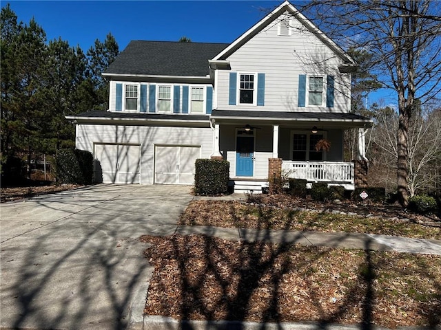 view of property featuring a garage and covered porch