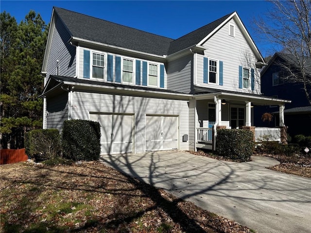 view of front facade with a garage and covered porch