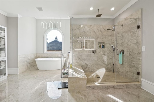 3423 Jamont Blvd, Alpharetta, GA 30022 - bathroom featuring marble tiled flooring, ornamental molding, a soaking tub, a marble finish shower, and recessed lighting
