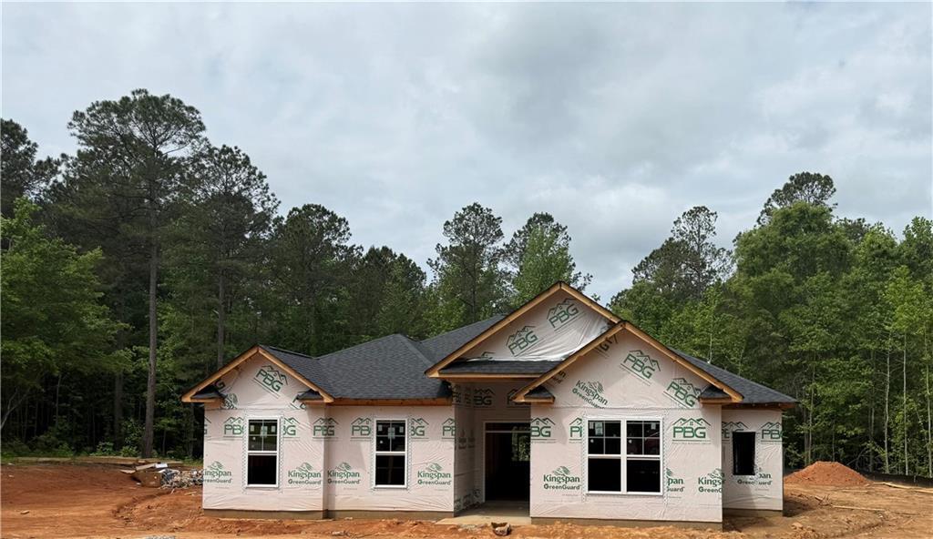 2231 Fox Creek Dr, Lot Court, Haddock, GA 31033 - unfinished property with a view of trees, stucco siding, and a shingled roof
