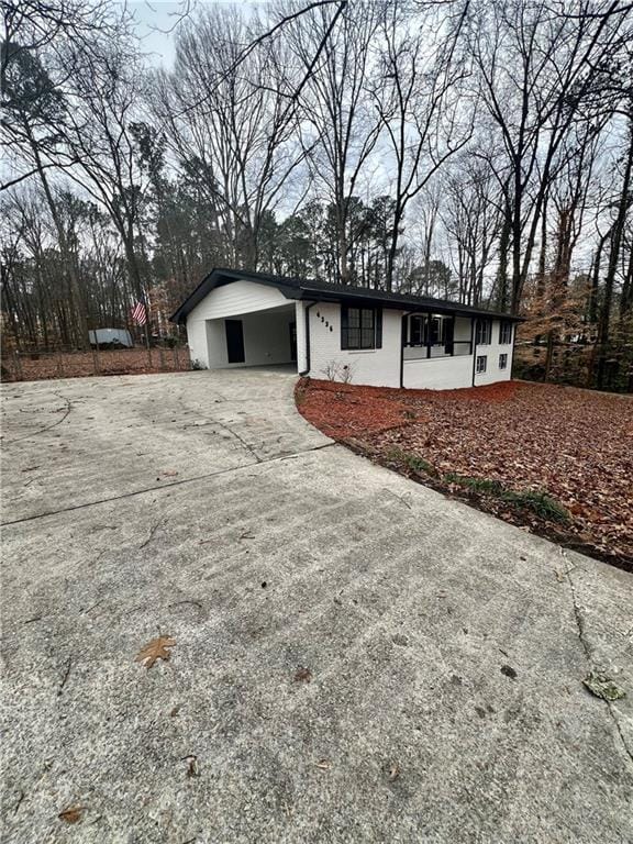 ranch-style house with a carport