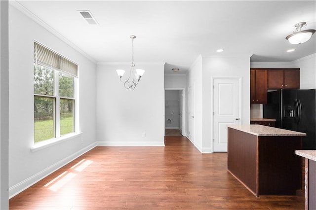 1433 Sand Way, Lawrenceville, GA 30045 - kitchen featuring a chandelier, ornamental molding, dark wood finished floors, a center island, and baseboards