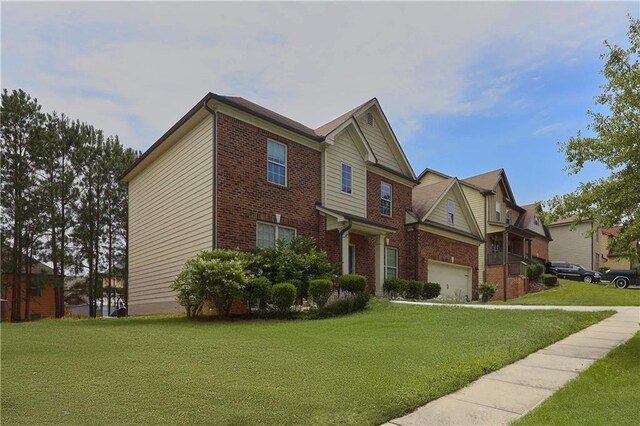 1433 Sand Way, Lawrenceville, GA 30045 - view of front of home featuring brick siding, a front lawn, and a garage