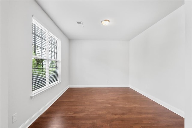 1433 Sand Way, Lawrenceville, GA 30045 - unfurnished room with dark wood finished floors and baseboards