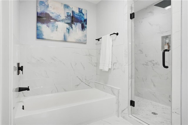 bathroom with separate shower and tub