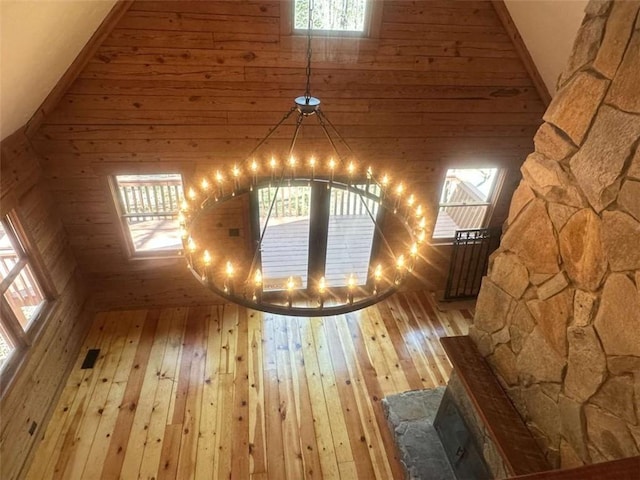 68 Star Lake Ln, Sautee Nacoochee, GA 30571 - additional living space with a chandelier, light wood-style flooring, wood walls, and high vaulted ceiling