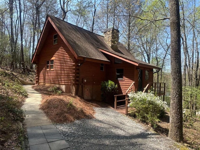 68 Star Lake Ln, Sautee Nacoochee, GA 30571 - view of home's exterior with a chimney, log exterior, and roof with shingles