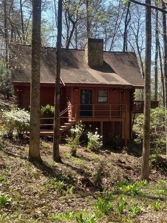 68 Star Lake Ln, Sautee Nacoochee, GA 30571 - back of house with a chimney, a wooden deck, roof with shingles, and log exterior