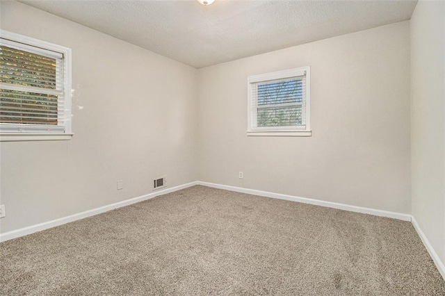 empty room with carpet flooring