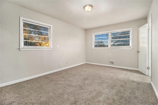 view of carpeted spare room