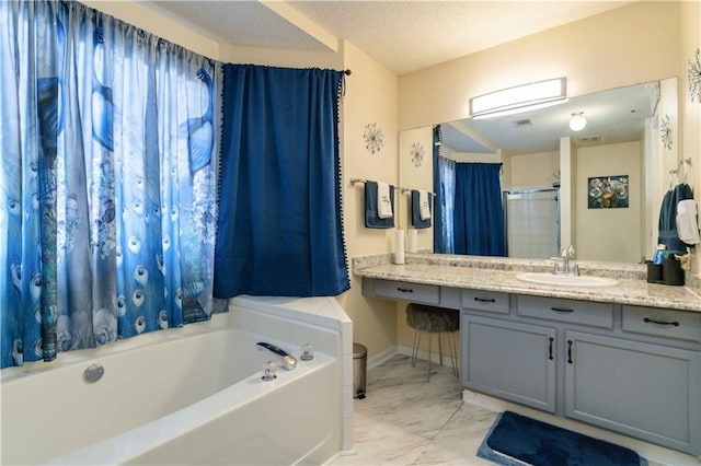 bathroom with vanity, a textured ceiling, and plus walk in shower