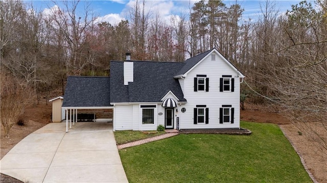 view of front of home featuring a shingled roof, driveway, a carport, a chimney, and a front yard