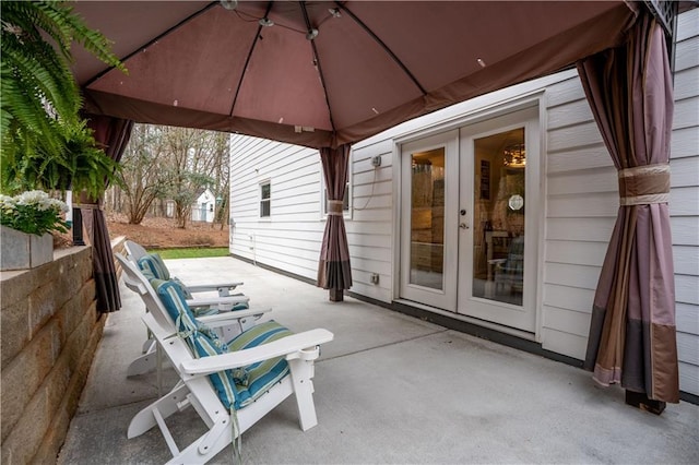 view of patio featuring a gazebo and french doors