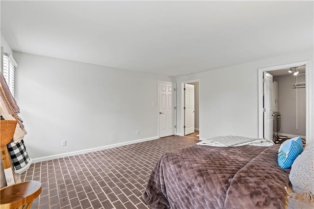 bedroom featuring baseboards