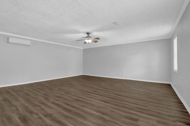 3618 Mansfield Ln, Snellville, GA 30039 - empty room featuring a ceiling fan, a wall mounted AC, ornamental molding, and dark wood finished floors