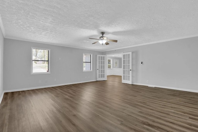 3618 Mansfield Ln, Snellville, GA 30039 - unfurnished room with dark wood-style flooring, crown molding, french doors, and a ceiling fan