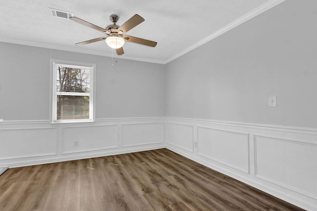 3618 Mansfield Ln, Snellville, GA 30039 - spare room with ceiling fan, visible vents, ornamental molding, and wood finished floors