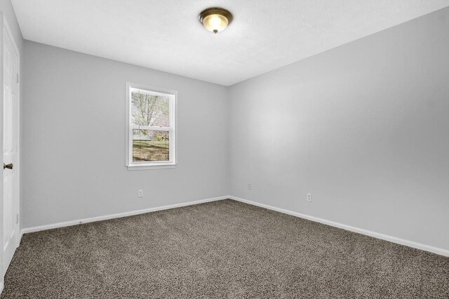 3618 Mansfield Ln, Snellville, GA 30039 - carpeted empty room with baseboards and a textured ceiling