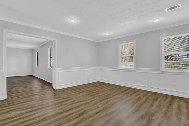 3618 Mansfield Ln, Snellville, GA 30039 - empty room featuring a textured ceiling, visible vents, crown molding, and wood finished floors