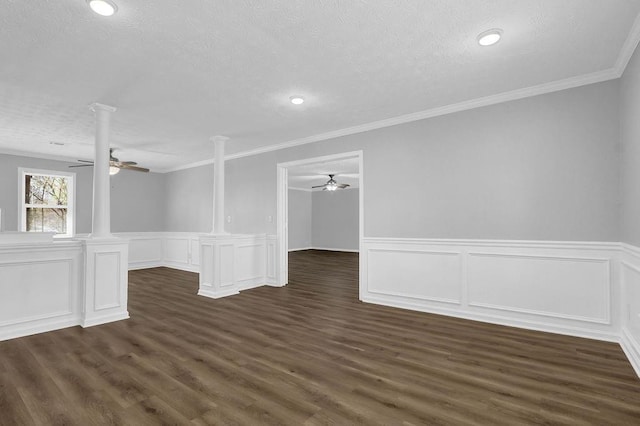 3618 Mansfield Ln, Snellville, GA 30039 - empty room with decorative columns, a ceiling fan, and dark wood-style flooring