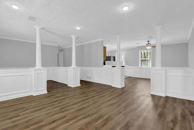 3618 Mansfield Ln, Snellville, GA 30039 - unfurnished living room featuring a textured ceiling, a ceiling fan, decorative columns, and dark wood finished floors