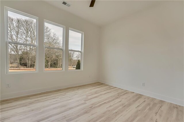 4265 Haynes Cir, Snellville, GA 30039 - unfurnished living room featuring ceiling fan and light wood-type flooring