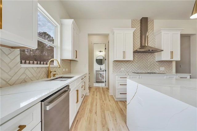 4265 Haynes Cir, Snellville, GA 30039 - kitchen featuring a large island, stainless steel appliances, white cabinets, decorative light fixtures, and wall chimney exhaust hood