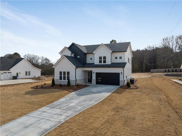 modern inspired farmhouse featuring a garage, a front yard, and central air condition unit