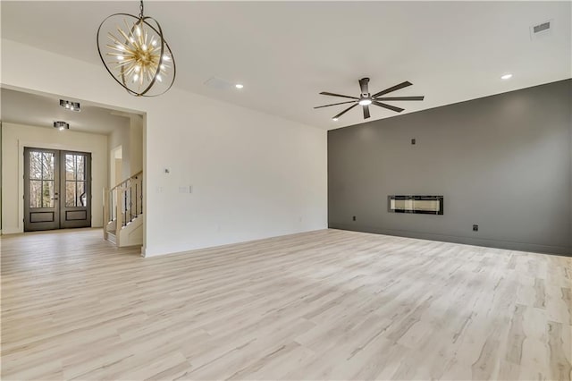 4265 Haynes Cir, Snellville, GA 30039 - unfurnished living room with sink, ceiling fan, and light hardwood / wood-style floors