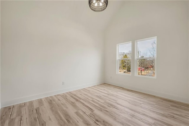 4265 Haynes Cir, Snellville, GA 30039 - spare room with light hardwood / wood-style flooring and a high ceiling