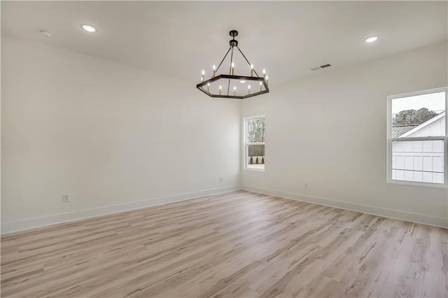 4265 Haynes Cir, Snellville, GA 30039 - spare room with a chandelier and light hardwood / wood-style floors