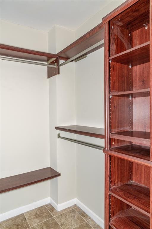 spacious closet featuring tile patterned floors