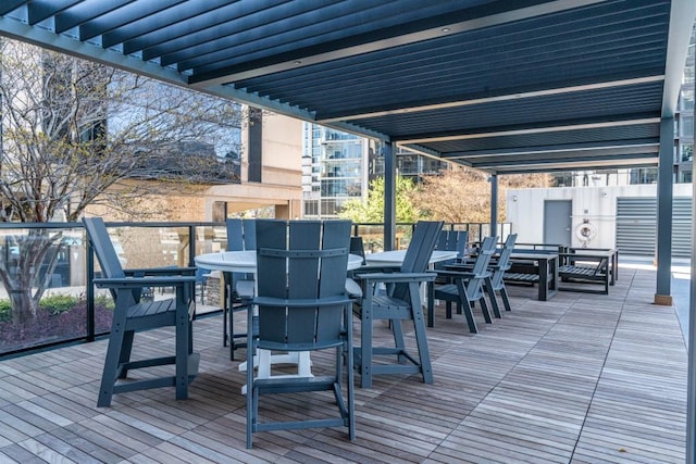 wooden deck featuring outdoor dining area