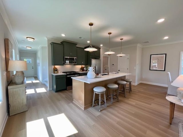 120 Winsome Way, Woodstock, GA 30188 - kitchen with stainless steel appliances, light wood-style flooring, ornamental molding, a breakfast bar, and light countertops