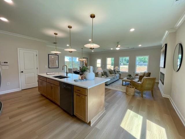 120 Winsome Way, Woodstock, GA 30188 - kitchen featuring dishwasher, light wood-style flooring, ornamental molding, light countertops, and a center island with sink