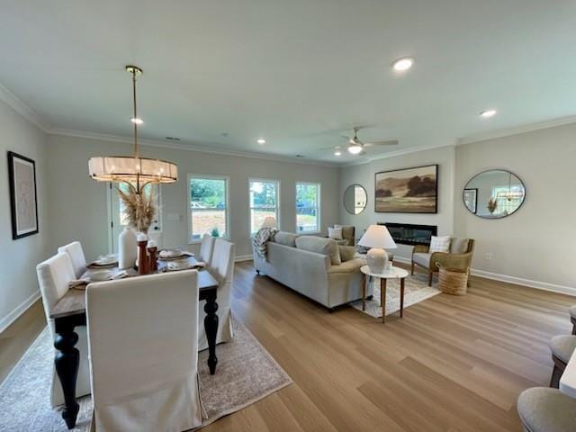 120 Winsome Way, Woodstock, GA 30188 - living area with ornamental molding, a chandelier, wood finished floors, ceiling fan, and recessed lighting