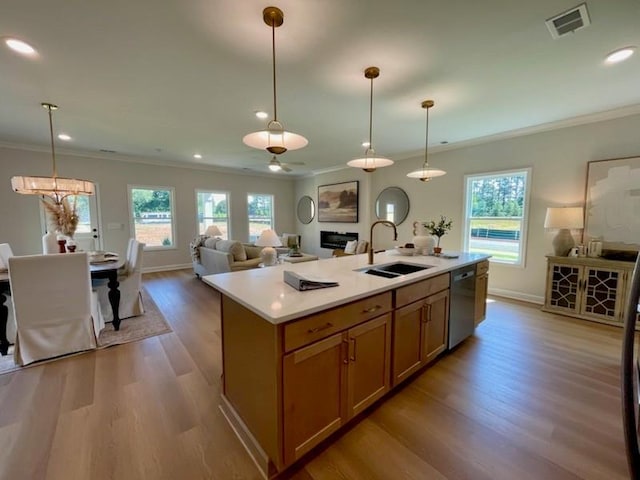 120 Winsome Way, Woodstock, GA 30188 - kitchen featuring dishwasher, ornamental molding, wood finished floors, light countertops, and open floor plan