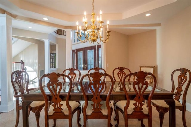 dining room with a notable chandelier and french doors