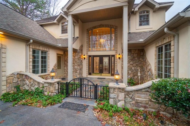 property entrance with french doors and a balcony