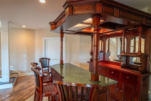 dining room with hardwood / wood-style flooring