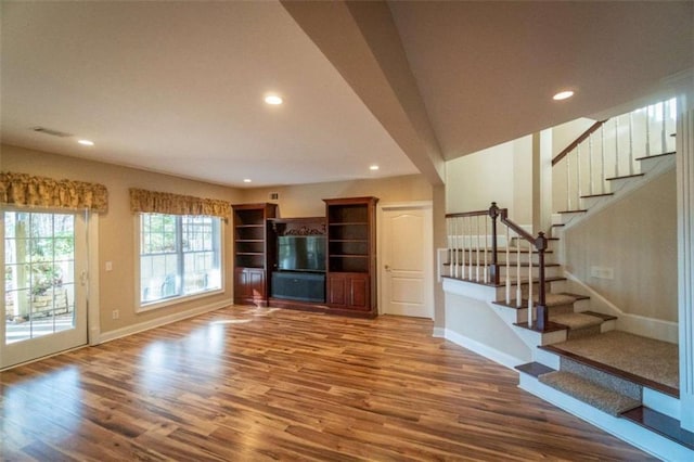 unfurnished living room featuring hardwood / wood-style floors