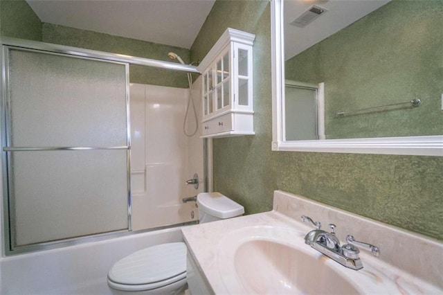 full bathroom featuring vanity, toilet, and enclosed tub / shower combo