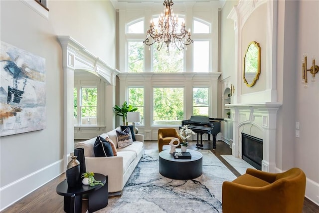 sunroom featuring an inviting chandelier and a healthy amount of sunlight