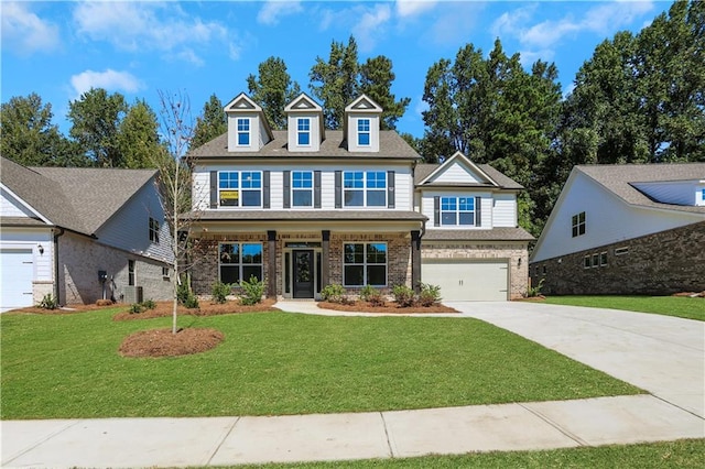 view of front of house with central AC, a front yard, a porch, and a garage